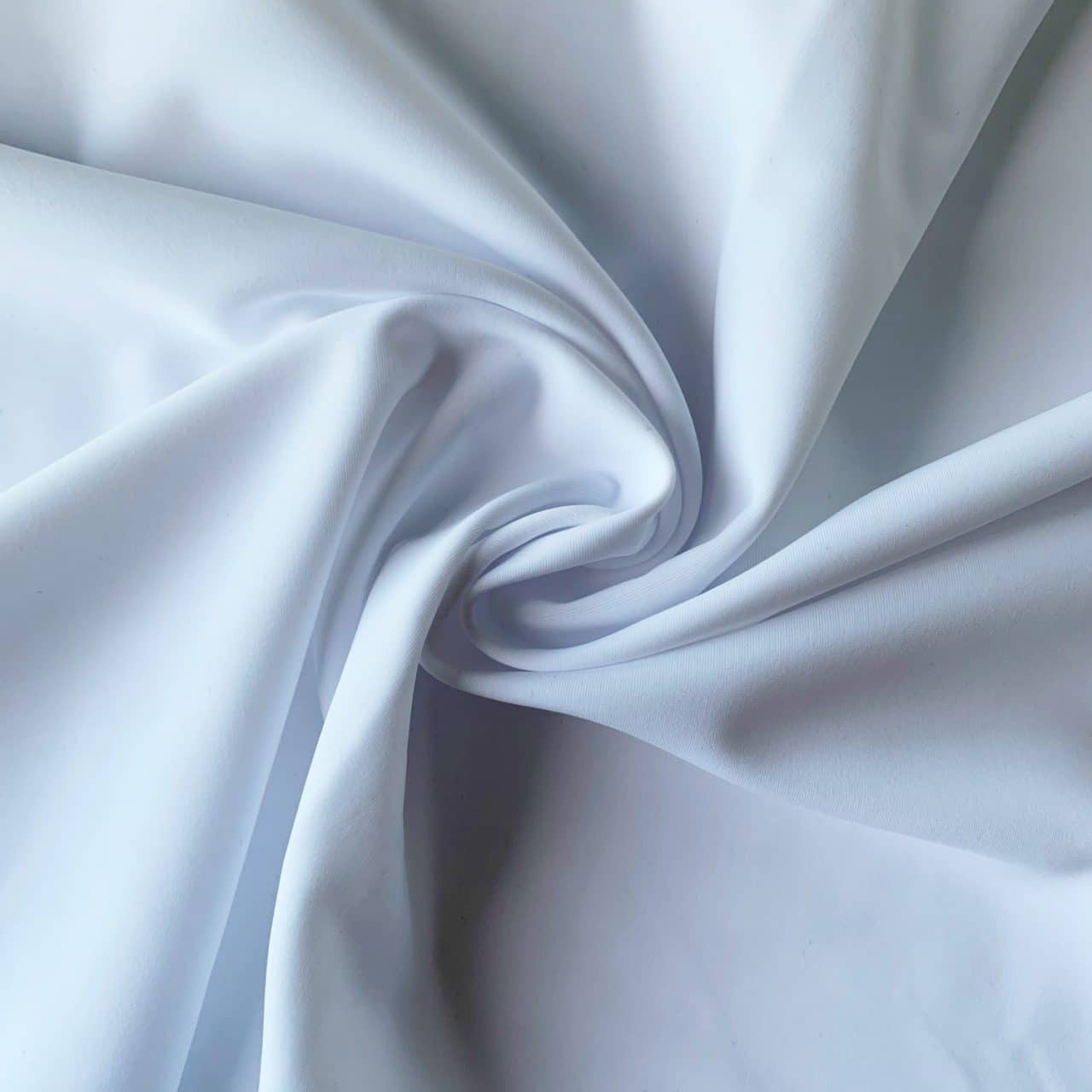 https://www.solidstonefabrics.com/wp-content/uploads/2018/06/Carvico-VITA-Econyl-Recycled-Nylon-Swimwear-Fabric-Bianco-White-Italian-Recycled-Swimwear-Fabric-2.jpg